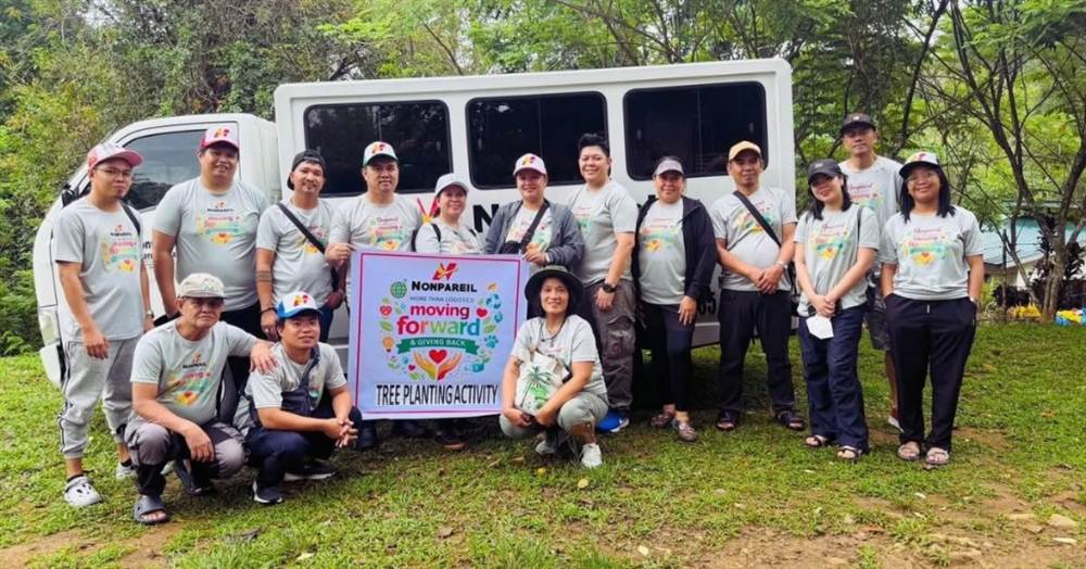 Nonpareil team group photo in front of van at Tanay Rizal tree planting site