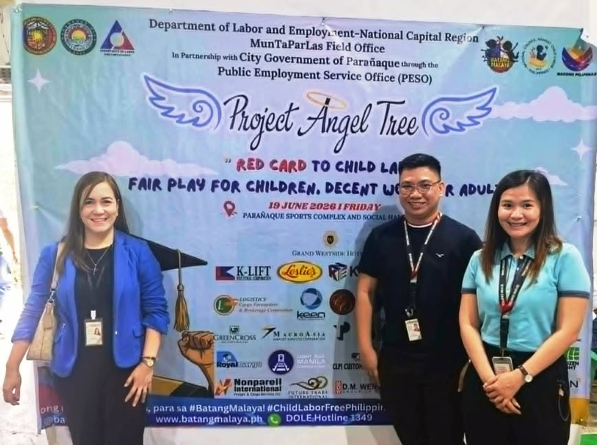 Three Nonpareil team members with Project Angel Tree partners at the event venue